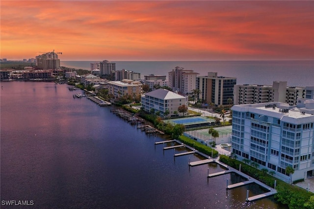 aerial view at dusk with a water view