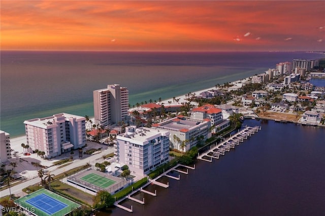 aerial view at dusk with a water view