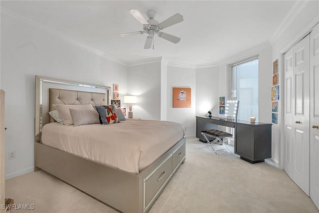 bedroom featuring crown molding, a closet, ceiling fan, and light carpet