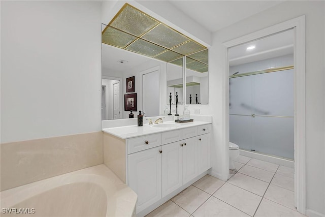 full bathroom with independent shower and bath, vanity, tile patterned floors, and toilet