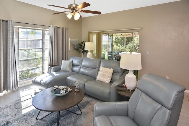 living area featuring ceiling fan and a wealth of natural light