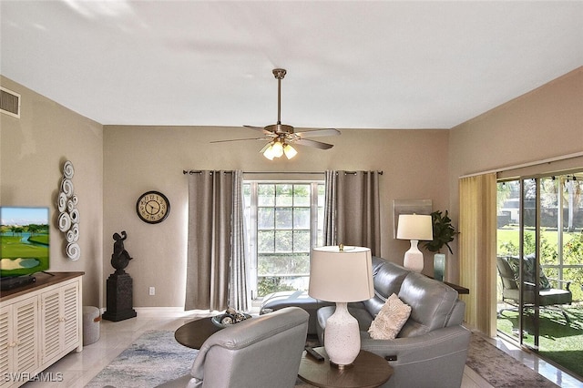 interior space featuring ceiling fan, visible vents, and baseboards