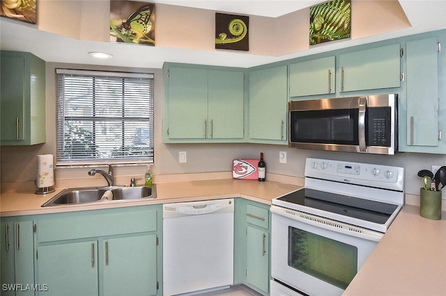 4 Park Lane Cir, Lehigh Acres, FL 33936 - kitchen featuring white appliances and light countertops
