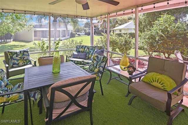 sunroom / solarium with plenty of natural light and ceiling fan