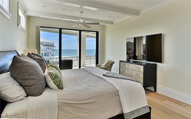 bedroom featuring wood finished floors, baseboards, beam ceiling, ornamental molding, and access to exterior