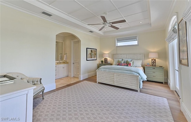 104 Bonaire Ln, Bonita Springs, FL 34134 - bedroom with visible vents, baseboards, arched walkways, light wood-style floors, and a tray ceiling