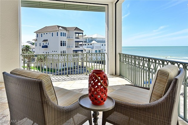 balcony featuring a water view