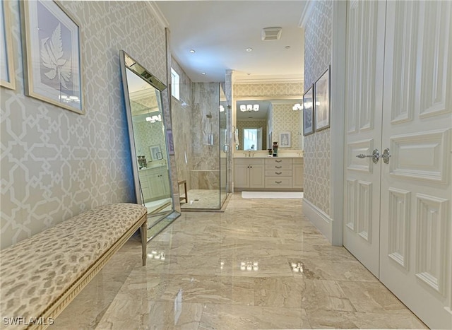 bathroom featuring wallpapered walls, a shower stall, vanity, and marble finish floor