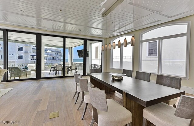 104 Bonaire Ln, Bonita Springs, FL 34134 - dining space with plenty of natural light, floor to ceiling windows, light wood-style flooring, and wood ceiling