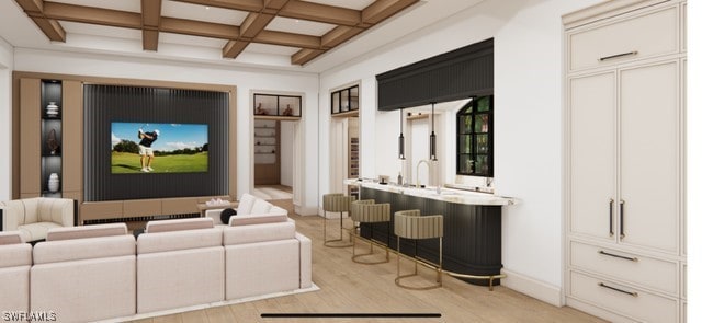 interior space with light wood-style floors, beam ceiling, and coffered ceiling