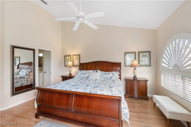 bedroom with ceiling fan, high vaulted ceiling, and light wood-type flooring