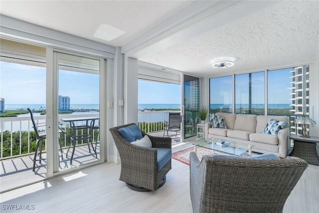 sunroom with a water view