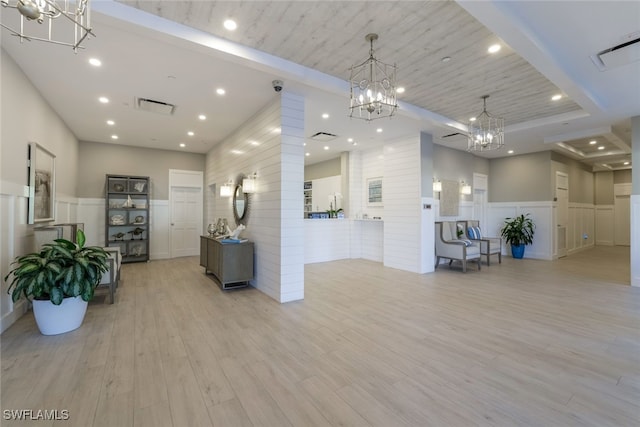 interior space with an inviting chandelier and visible vents