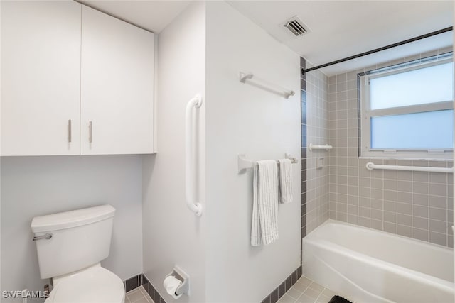 bathroom featuring toilet, visible vents, and shower / washtub combination