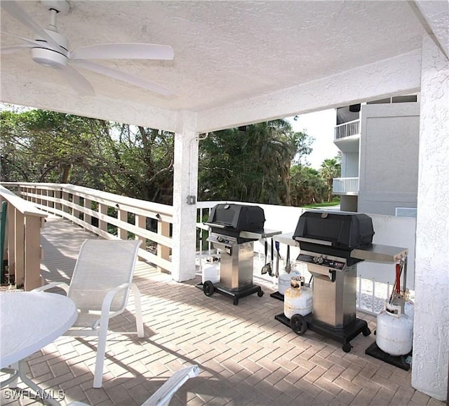 view of patio / terrace with ceiling fan and grilling area