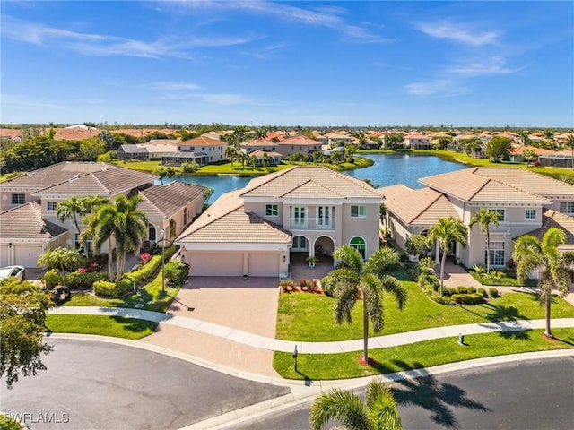 bird's eye view featuring a residential view and a water view