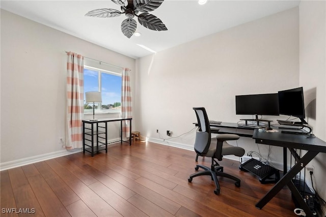 office space with a ceiling fan, wood finished floors, and baseboards