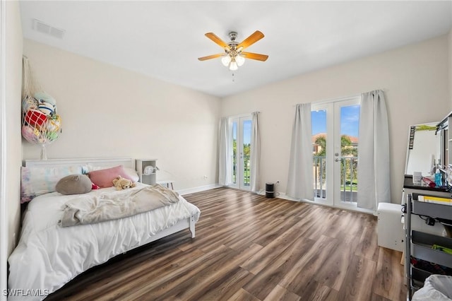 bedroom with french doors, visible vents, wood finished floors, and access to outside