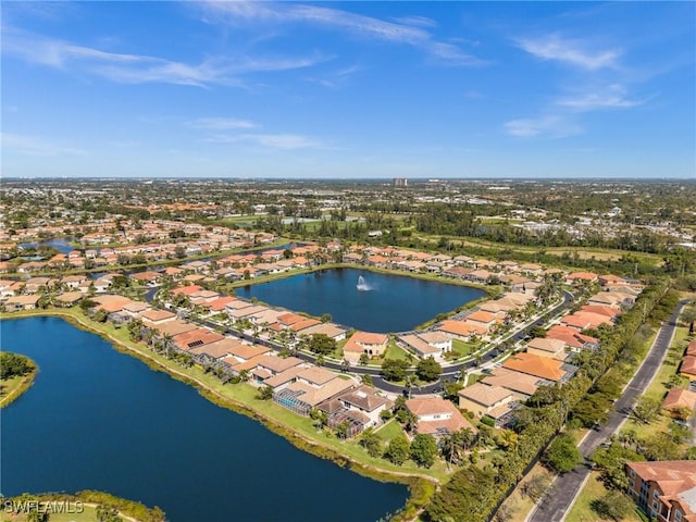 aerial view featuring a residential view and a water view