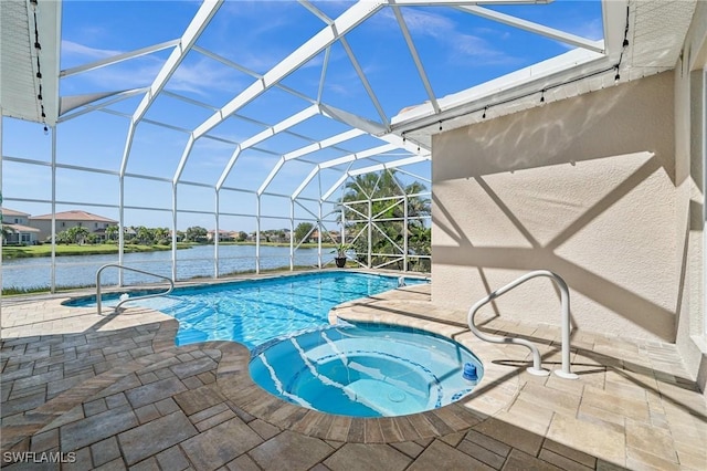 view of pool featuring a water view, a pool with connected hot tub, a lanai, and a patio area