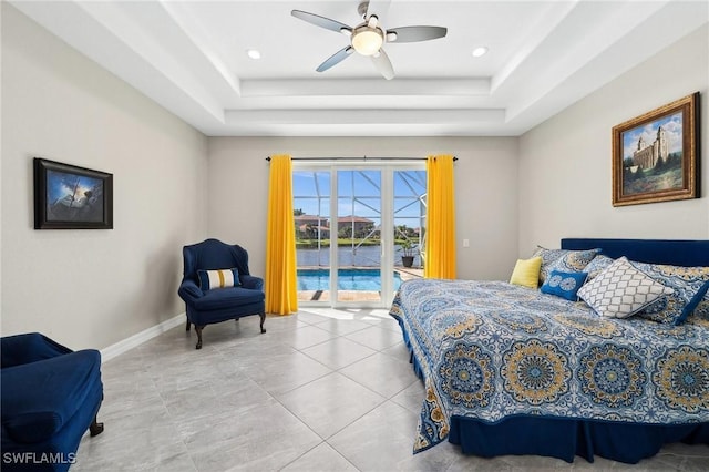 tiled bedroom with access to exterior, baseboards, a tray ceiling, and a ceiling fan