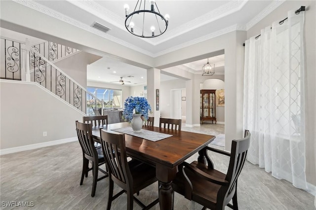 dining space with baseboards, visible vents, stairs, crown molding, and a raised ceiling