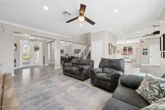 living room featuring visible vents, ceiling fan with notable chandelier, recessed lighting, baseboards, and stairs