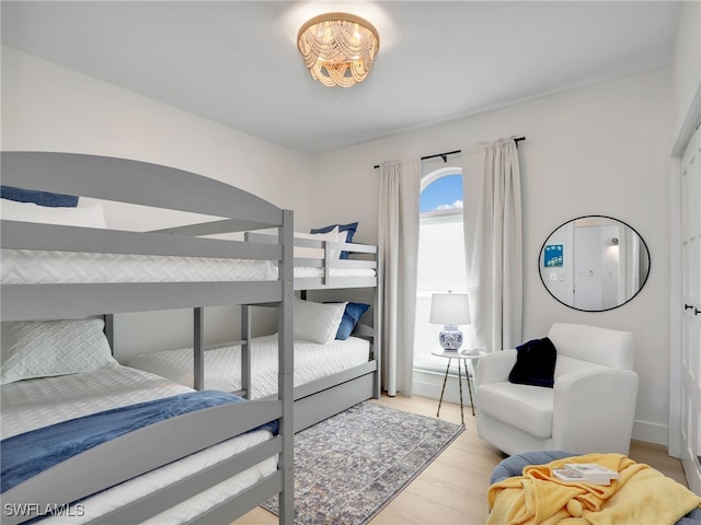 bedroom featuring light wood-style floors