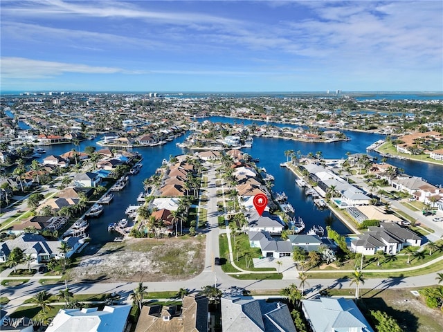 drone / aerial view featuring a residential view and a water view