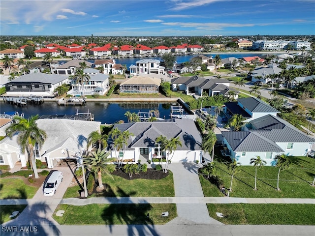 aerial view with a residential view and a water view