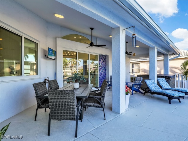 view of patio / terrace with outdoor dining space and ceiling fan