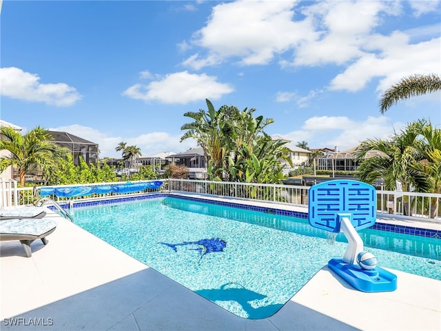 view of swimming pool featuring a fenced in pool