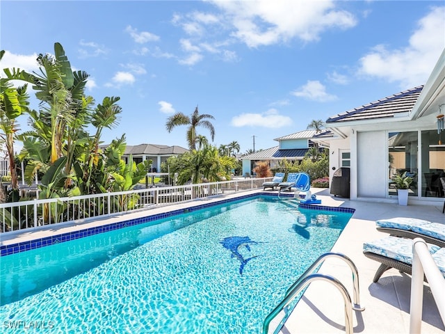 view of pool featuring a patio, fence, and a fenced in pool