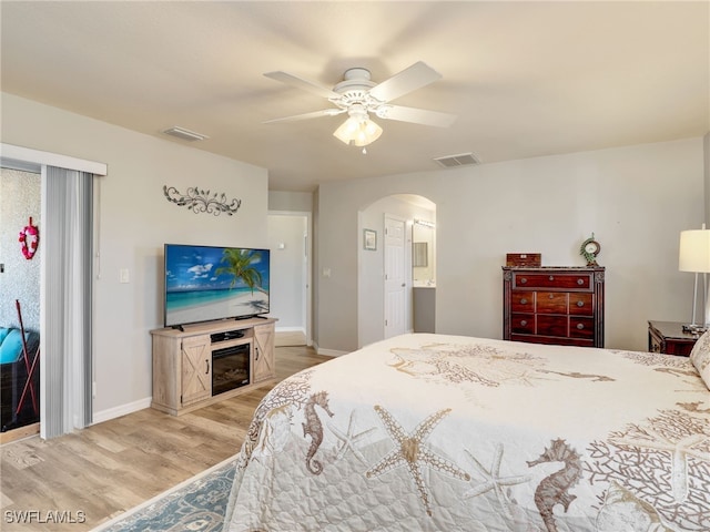 bedroom with ceiling fan and light hardwood / wood-style floors