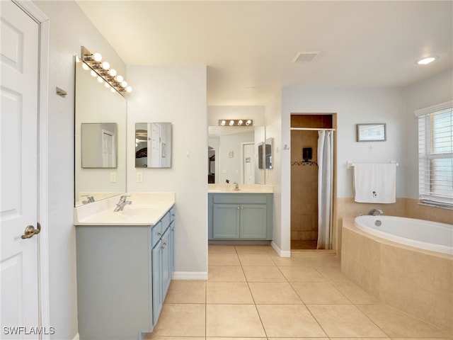 bathroom with vanity, separate shower and tub, and tile patterned floors