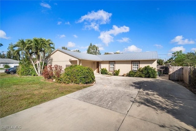 ranch-style home with a front lawn