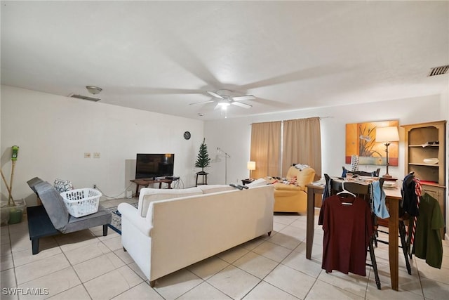 tiled living room featuring ceiling fan