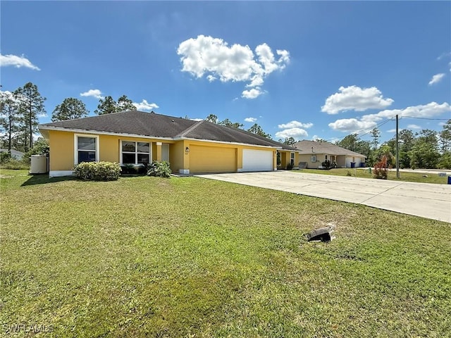351 Justice Ave, Lehigh Acres, FL 33972 - single story home featuring an attached garage, driveway, a front yard, and stucco siding