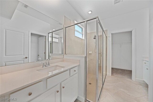 bathroom featuring vanity and walk in shower