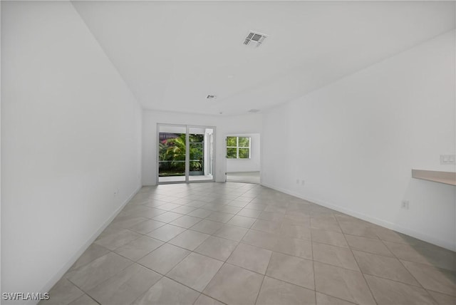 empty room with light tile patterned floors