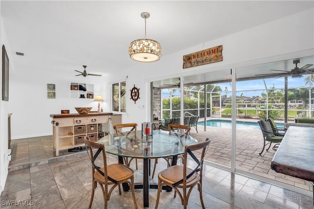 dining space featuring visible vents and ceiling fan