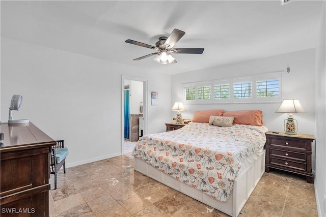 bedroom featuring ceiling fan and baseboards