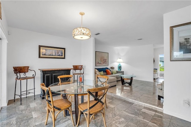 dining area featuring visible vents