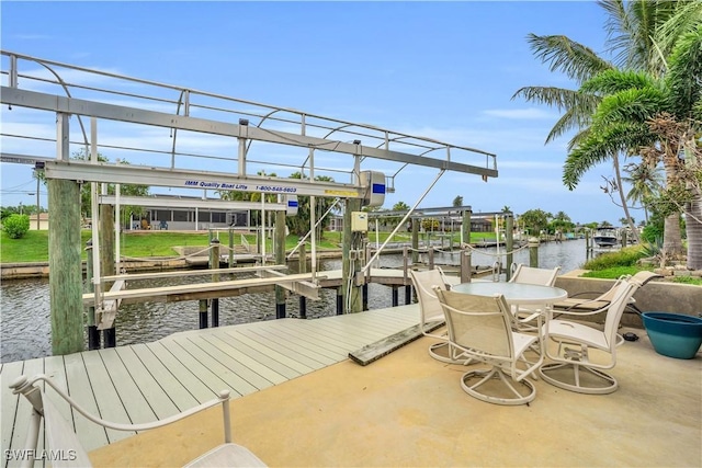 view of dock featuring a water view and boat lift