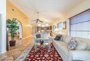 595 103rd Ave, Naples, FL 34108 - living area with ceiling fan and vaulted ceiling