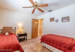 595 103rd Ave, Naples, FL 34108 - bedroom with ceiling fan