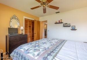 595 103rd Ave, Naples, FL 34108 - bedroom with a closet and a ceiling fan