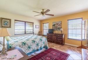 595 103rd Ave, Naples, FL 34108 - bedroom with baseboards, a ceiling fan, and tile patterned floors