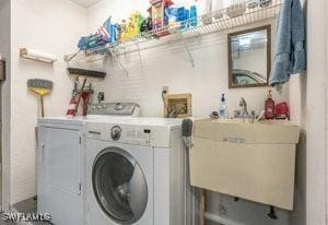 595 103rd Ave, Naples, FL 34108 - laundry area featuring a sink, laundry area, and independent washer and dryer