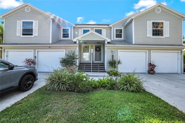 view of front of property featuring a garage and driveway